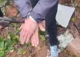 Young man being punished with gunshots to the hands and feet by faction members Photo 0001