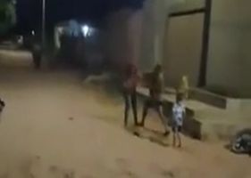 A man beating a woman in the middle of the street, in front of her young son, suffers severe punishment when he is confronted in combat by another man who thinks that aggression is unfair Photo 0001