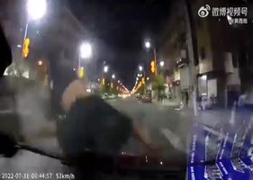 Drunk guy on bike hits car in China Photo 0001
