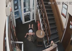 Drunk woman fighting on the stairs Photo 0001