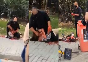 Woman is slaughtered and partially beheaded in Xangai, China, in broad daylight by a man while crowd watches Photo 0001