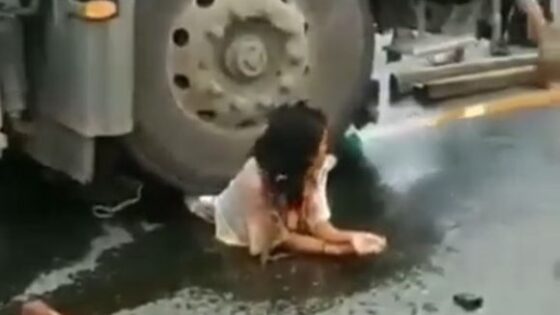Woman still alive with half her body crushed by truck in some country in Asia Photo 0001 Video Thumb