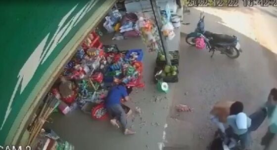 Man being killed with ax blows in front of a store Photo 0001 Video Thumb