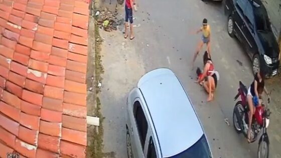 Woman attacking mother holding baby on motorcycle Photo 0001 Video Thumb