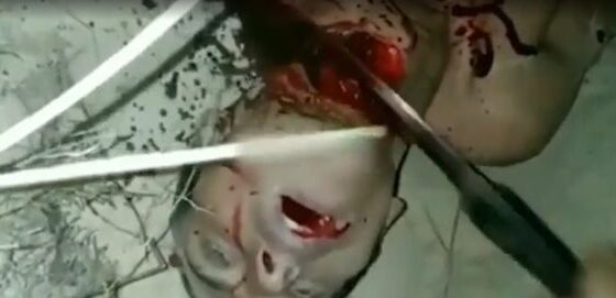 Man being beheaded slowly with a knife in the neck without mercy Photo 0001 Video Thumb