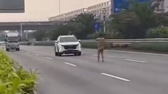 Man without clothes in the middle of the road hit by suv Photo 0001 Video Thumb