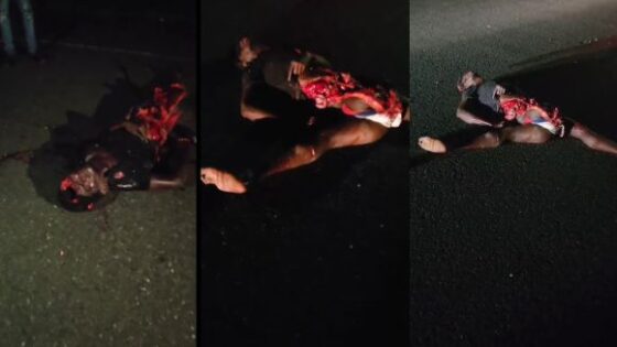 Man torn to pieces crushed and left with his guts hanging out on the asphalt after being crushed by a truck Photo 0001 Video Thumb