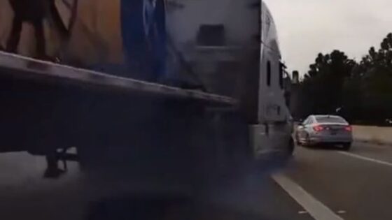 Driver loses control and truck hits car on freeway Photo 0001 Video Thumb