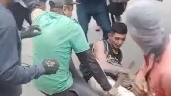 Thief holding knife punished hard by angry crowds Photo 0001 Video Thumb