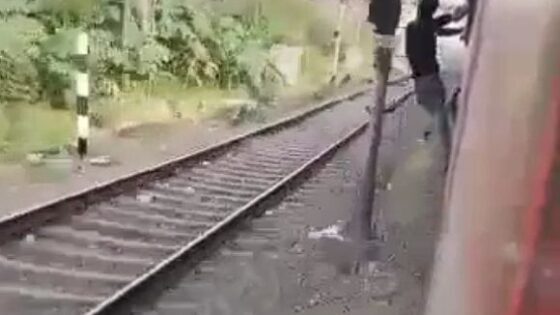 Dude hanging from a train suffers a terrible accident due to lack of safety Photo 0001 Video Thumb