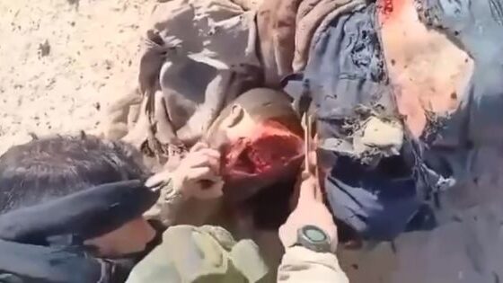 Iraqi troops decapitate what appears to be an enemy combatant Photo 0001 Video Thumb