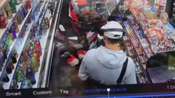White dude punches black mans face in the market in the usa for no apparent reason Photo 0001 Video Thumb