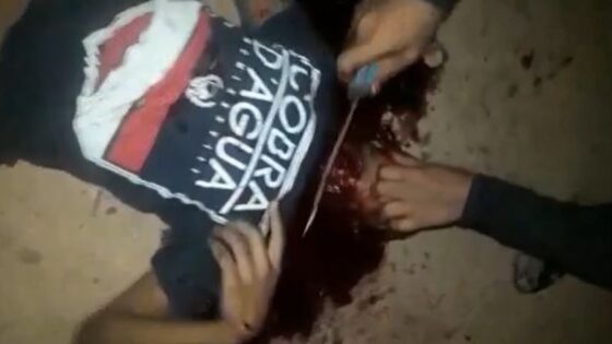 Member of a rival faction being beheaded with a sharp knife in brazil Photo 0001 Video Thumb