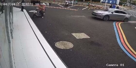 Couple on motorcycle is hit by speeding car in china Photo 0001 Video Thumb