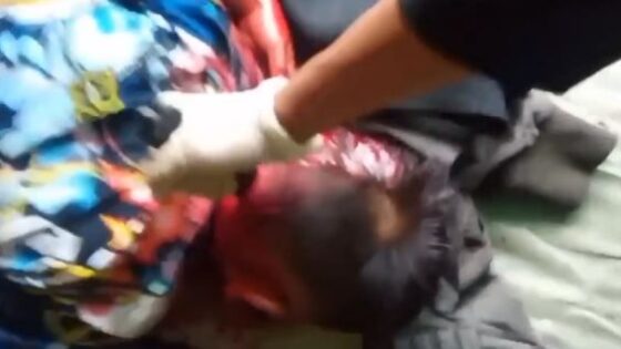 Man sticking knife into childs head for no apparent reason no more info Photo 0001 Video Thumb