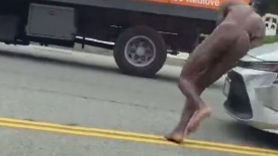 Naked black man running madly in the middle of the street i wonder why Photo 0001 Video Thumb