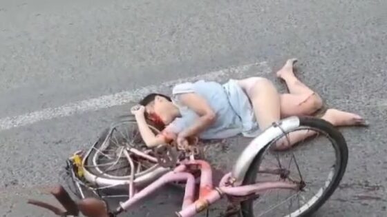 A young asian girl and her bycicle ware crushed under truck Photo 0001 Video Thumb
