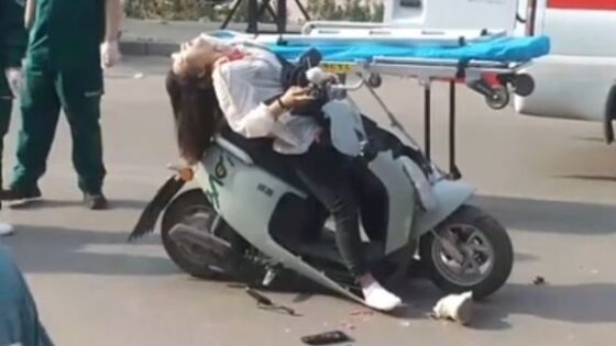 Asian girl drived her scooter under a trailer in a traffic accident Photo 0001 Video Thumb