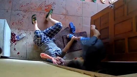 Distraught man kills his own wife with a butcher knife in some asian country Photo 0001 Video Thumb