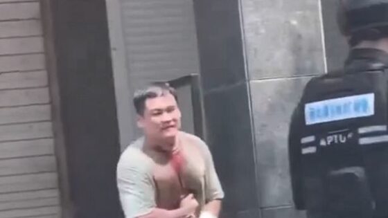 Man stabs himself and cuts his own neck with a knife in front of police in some asian country Photo 0001 Video Thumb