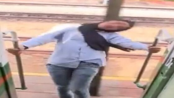 Woman almost loses her head while playing in the train door Photo 0001 Video Thumb