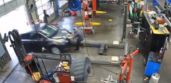 Mechanic in the usa is run over inside his mechanic shop by an out of control car Photo 0001 Video Thumb