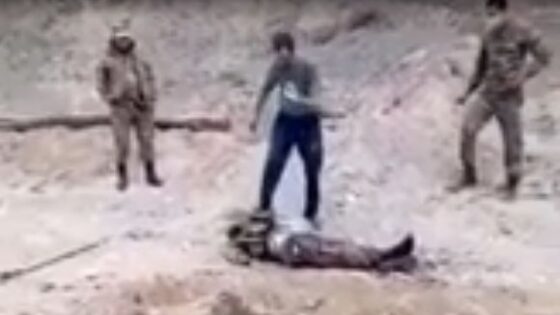 Soldiers burn the corpse of an enemy soldier Photo 0001 Video Thumb
