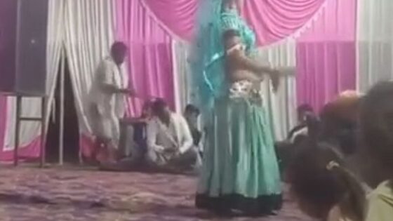 While a woman dances a man is hit in the head with an ax Photo 0001 Video Thumb