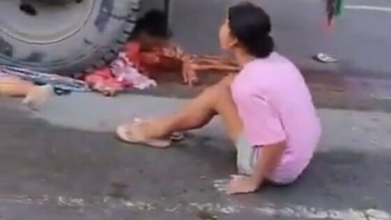 Woman crushed by truck wheels in india while her relative lies crying on the ground without hope Photo 0001 Video Thumb