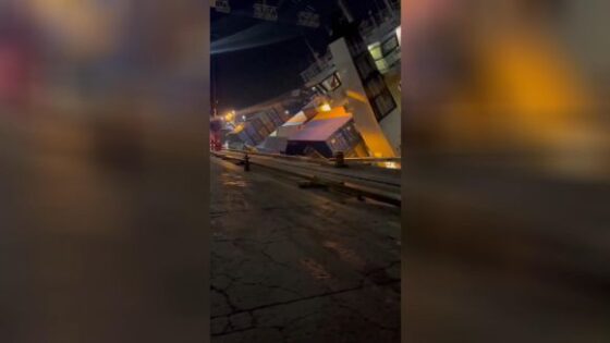 A huge cargo ship overturned with its crew on top of it Photo 0001 Video Thumb