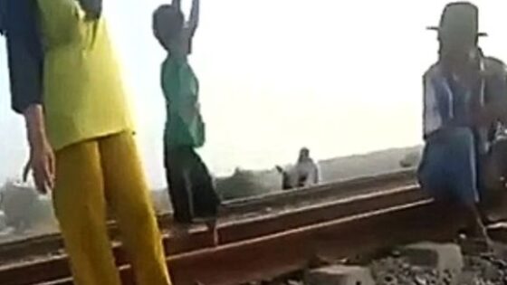 Someone should teach these kids the train tracks are not a playground Photo 0001 Video Thumb