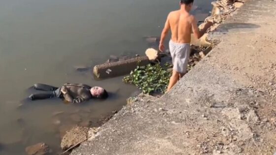 Womans body is found floating in a river in some asian country Photo 0001 Video Thumb