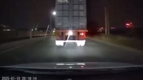 Motorcyclist loses balance and falls under a truck Photo 0001 Video Thumb