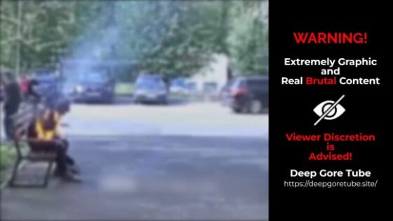 Sitting man catches fire by himself Photo 0001 Video Thumb